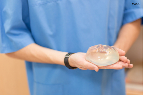 silicone breast implant. doctor hold silicone breast implant-img-blog