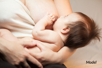 Woman breastfeeding her child.