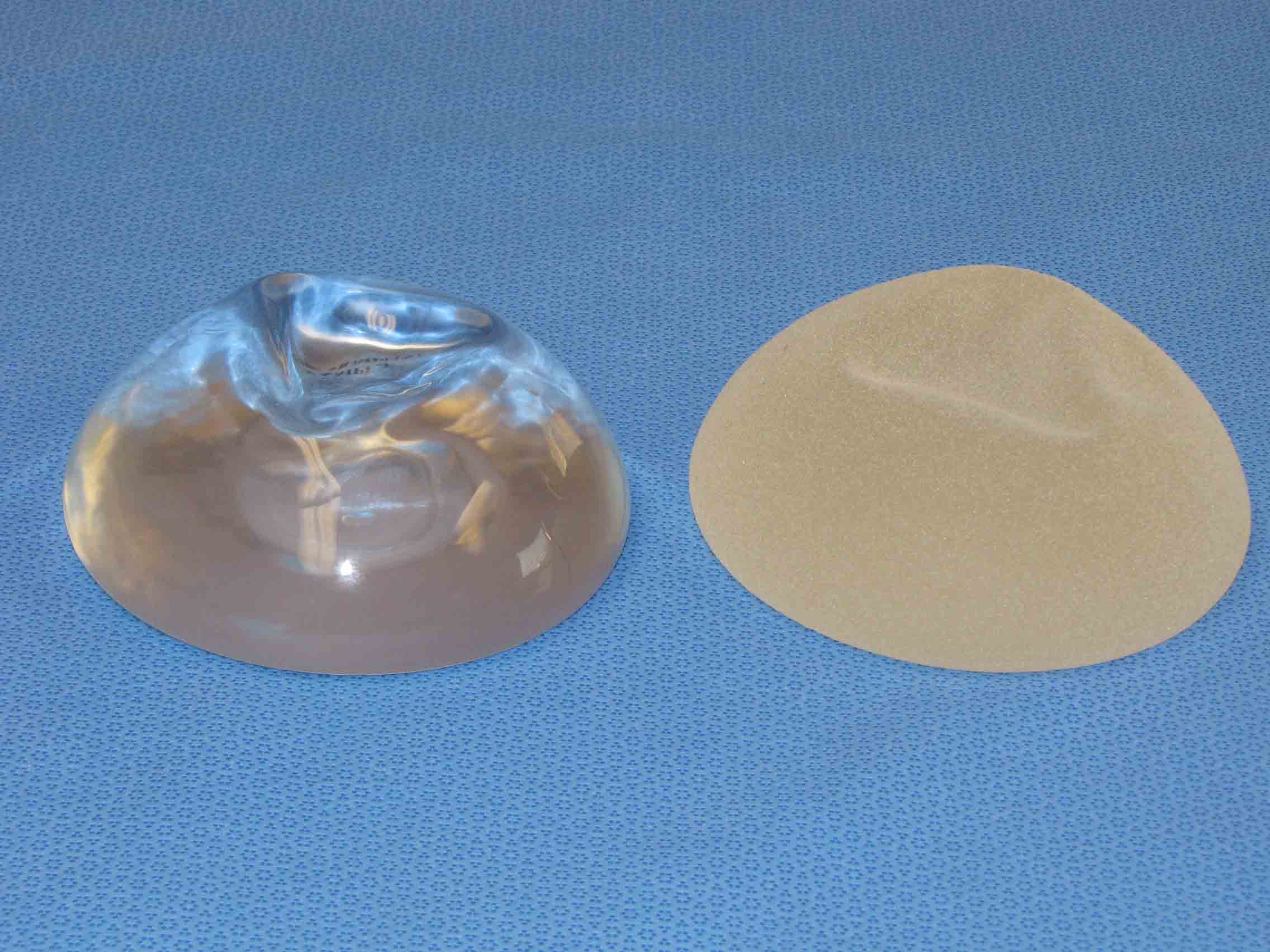 Smooth(left) and a textured(right) silicone implants