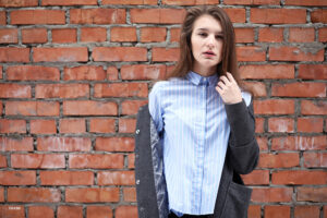 A person in a blue button up shirt